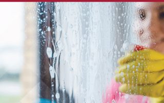 woman cleaning window