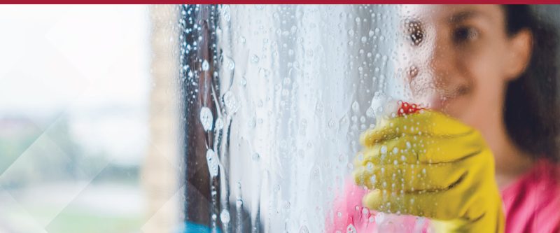 woman cleaning window